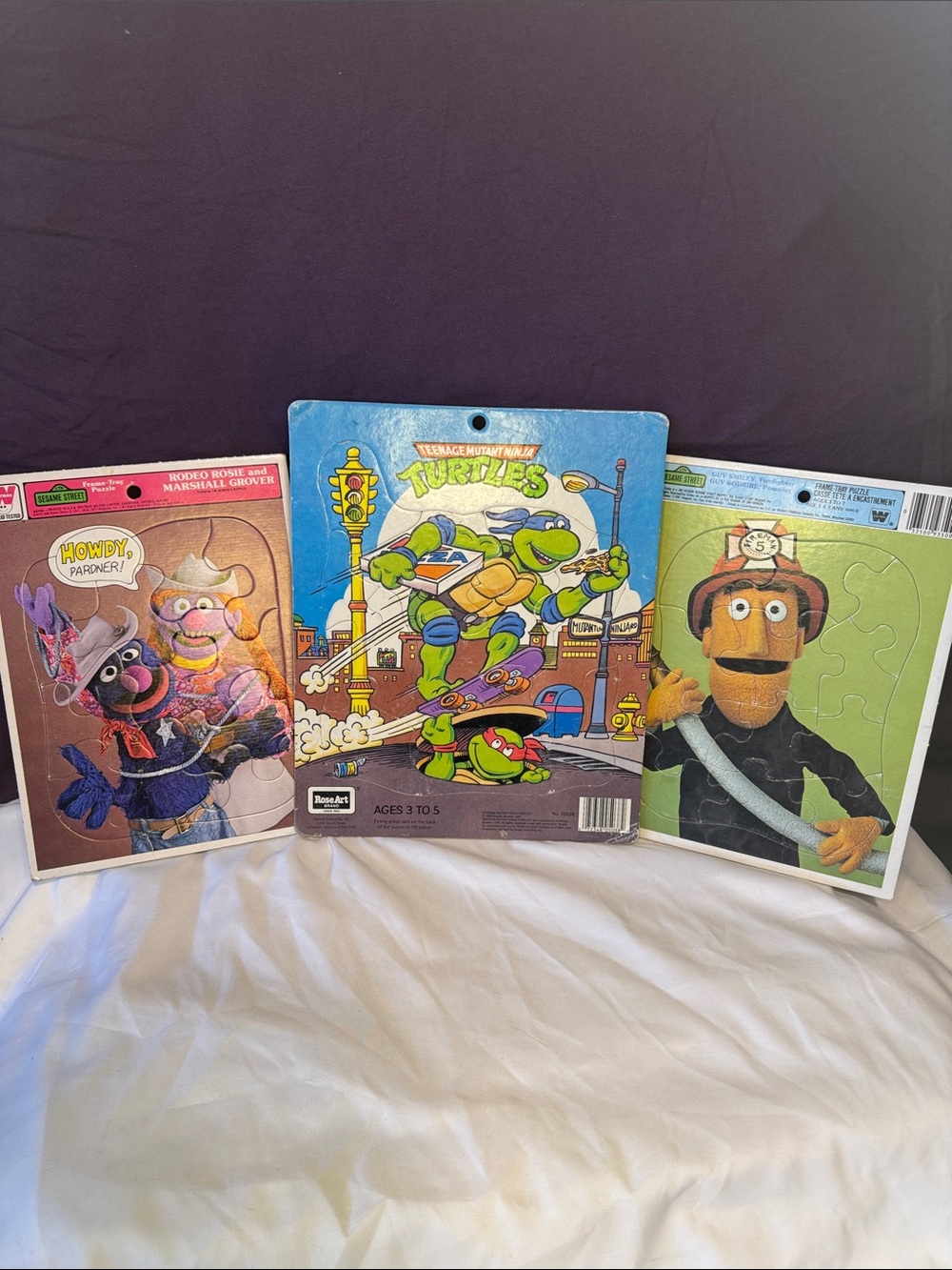 Three vintage tray puzzles Sesame Street teenage mutant